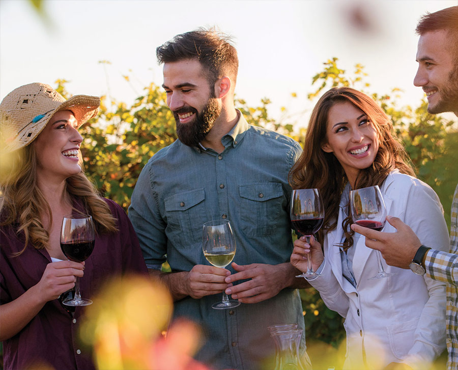 Couples celebrating event with wine